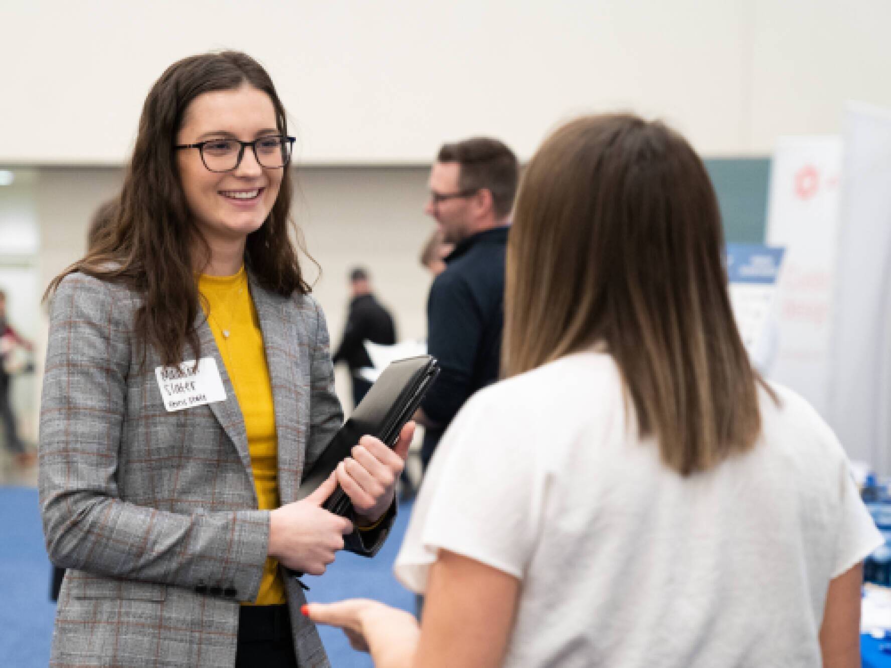 two people networking at the career fair